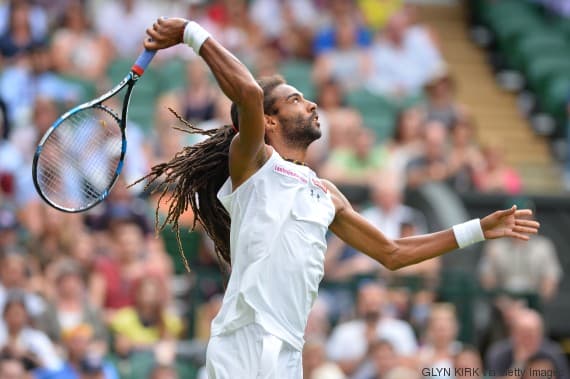 Germany's Dustin Brown prepares to smash a return against Spain's Rafael Nadal during their men's singles second round match on day four of the 2015 Wimbledon Championships at The All England Tennis Club in Wimbledon, southwest London, on July 2, 2015.   RESTRICTED TO EDITORIAL USE  --   AFP PHOTO / GLYN KIRK        (Photo credit should read GLYN KIRK/AFP/Getty Images)
