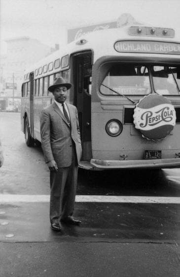 American Civil Rights leader Reverend Martin Luther King Jr.(1929 - 1968) stands in front of a bus at the end of the Montgomery bus boycott, Montgomery, Alabama, December 26, 1956. (Photo by Don Cravens/The LIFE Images Collection/Getty Images)