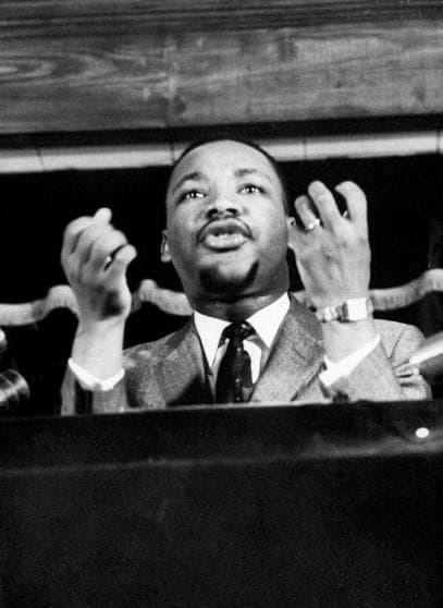 Civil rights leader Rev. Martin Luther King speaking from pulpit at mass meeting about principles of non-violence before leading assembly to ride newly integrated busses after successful boycott. (Photo by Don Cravens/The LIFE Images Collection/Getty Images)