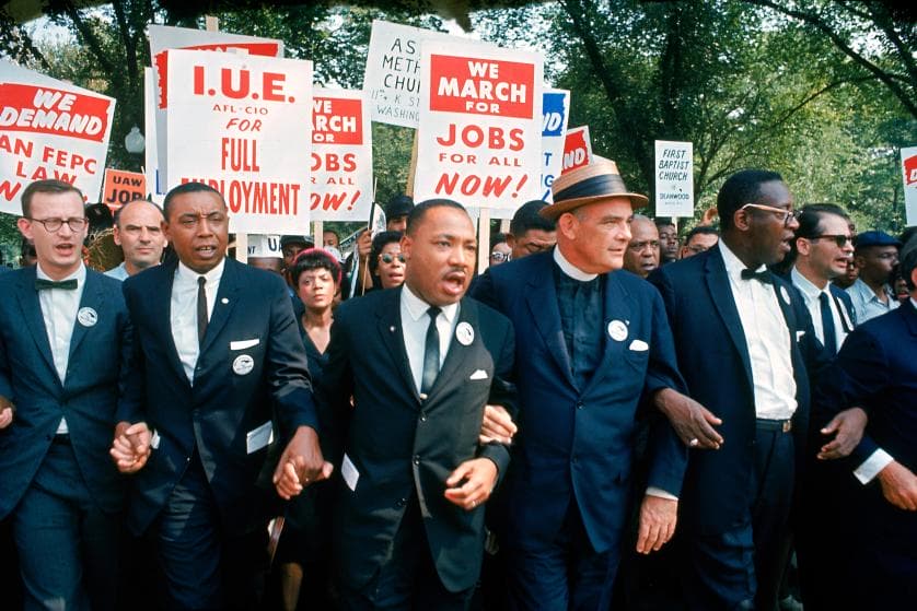 Leaders of March on Washington for Jobs & Freedom marching w. signs (R-L): Matthew Ahmann, Floyd McKissick, Martin Luther King Jr., Rev. Eugene Carson Blake and unident.