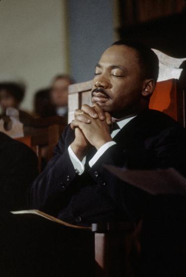 American religious and Civil Rights leader Martin Luther King Jr (1929 - 1968) leads a prayer in a church before the second Selma to Montgomery Civil Rights march, also known as 'Turnaround Tuesday', Selma, Alabama, 9th March 1965. (Photo by Frank Dandridge/The LIFE Images Collection/Getty Images)