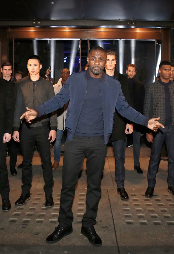 LONDON, ENGLAND - NOVEMBER 26: Idris Elba and models stop traffic as they arrive at Superdry Regent Street to celebrate the launch of the new premium menswear AW15 'Idris Elba + Superdry' collection on November 26, 2015 in London, England. (Photo by David M. Benett/Dave Benett / Getty Images for Superdry)