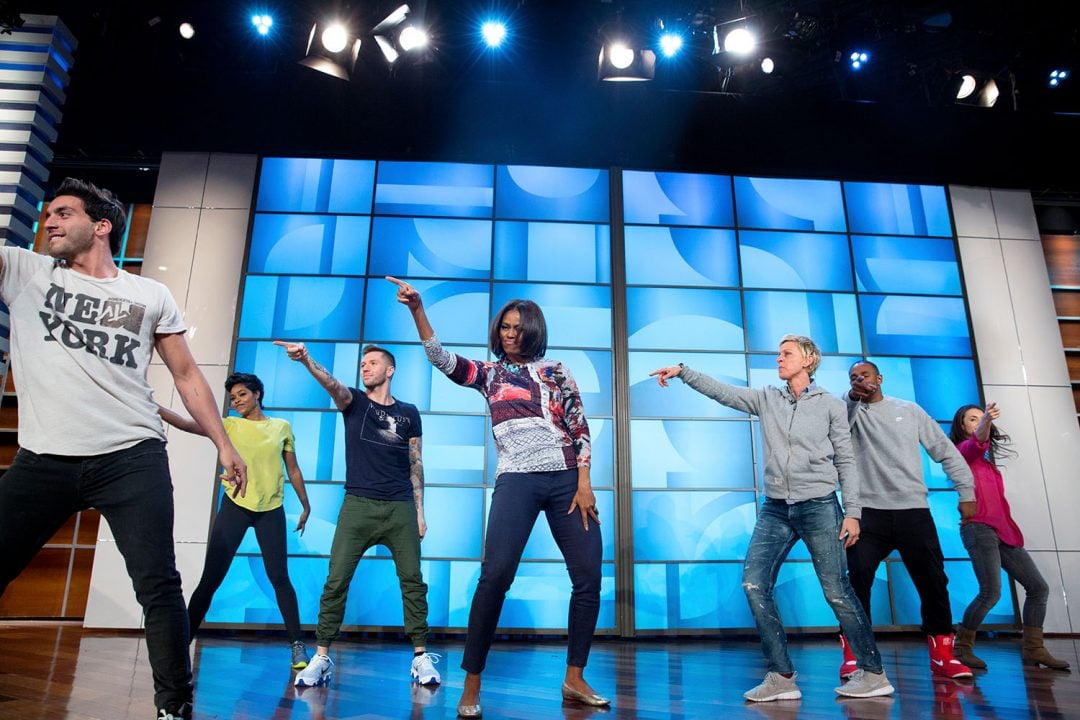 First Lady Michelle Obama rehearses with Ellen DeGeneres and the "So You Think You Can Dance" dancers for a #GimmeFive "Let's Move!" dance, prior to a taping of The Ellen DeGeneres Show in Burbank, Calif., March 12, 2015. (Official White House Photo by Amanda Lucidon) This official White House photograph is being made available only for publication by news organizations and/or for personal use printing by the subject(s) of the photograph. The photograph may not be manipulated in any way and may not be used in commercial or political materials, advertisements, emails, products, promotions that in any way suggests approval or endorsement of the President, the First Family, or the White House.