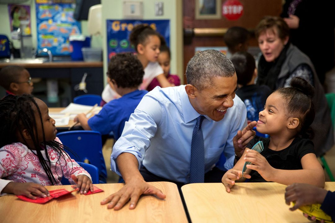 Jan. 22, 2015 "While we were in Lawrence, Kan., we stopped at the Community Children's Center–one of the nation's oldest Head Start providers. The President sat next to Akira Cooper, right, and reacted to something she said to him." (Official White House Photo by Pete Souza) This official White House photograph is being made available only for publication by news organizations and/or for personal use printing by the subject(s) of the photograph. The photograph may not be manipulated in any way and may not be used in commercial or political materials, advertisements, emails, products, promotions that in any way suggests approval or endorsement of the President, the First Family, or the White House.
