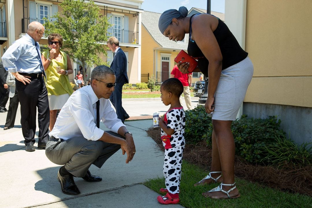 August 27, 2015 "Nice pajamas. The President greets residents in the Tremé neighborhood of New Orleans. The area experienced significant flooding during Hurricane Katrina ten years ago, and much of it has been rebuilt." (Official White House Photo by Pete Souza) This official White House photograph is being made available only for publication by news organizations and/or for personal use printing by the subject(s) of the photograph. The photograph may not be manipulated in any way and may not be used in commercial or political materials, advertisements, emails, products, promotions that in any way suggests approval or endorsement of the President, the First Family, or the White House.