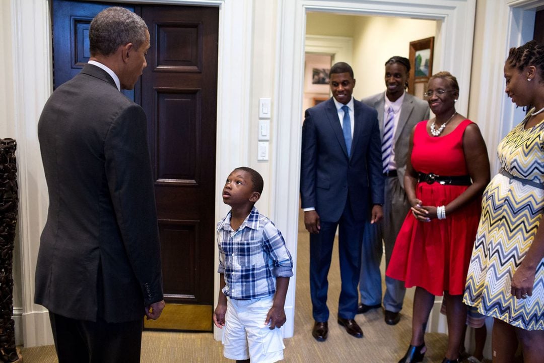 Sept. 4, 2015 "Four-year-old Malik Hall greets the President, almost in disbelief, before a departure photo with Malik's uncle Maurice Owens, center, and his family." (Official White House Photo by Pete Souza) This official White House photograph is being made available only for publication by news organizations and/or for personal use printing by the subject(s) of the photograph. The photograph may not be manipulated in any way and may not be used in commercial or political materials, advertisements, emails, products, promotions that in any way suggests approval or endorsement of the President, the First Family, or the White House.