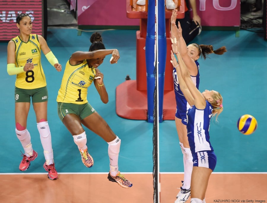 Brazil's captain Fabiana Claudino (2nd L, #1) attacks against Russia during their volleyball match of the FIVB Women's World Grand Prix finals in Tokyo on August 23, 2014. AFP PHOTO / KAZUHIRO NOGI (Photo credit should read KAZUHIRO NOGI/AFP/Getty Images)