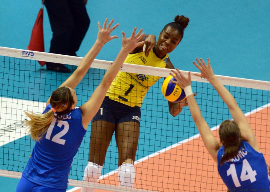 Brazil's Fabiana Claudino (C) spikes the ball against Serbia during the women's volleyball World Grand Prix Final in Sapporo, Japan's northern island of Hokkaido on August 31, 2013. Brazil defeated Serbia 27-25, 25-21, 25-22. AFP PHOTO / JIJI PRESS JAPAN OUT (Photo credit should read JIJI PRESS/AFP/Getty Images)