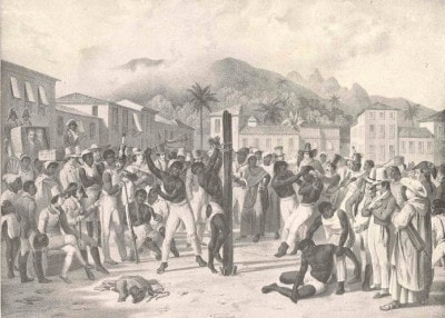 Quadro em preto e branco de um homem amarrado em um pal, sendo açoitado diante de uma multidão 